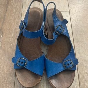 Used Bright Blue Dansko sandals.